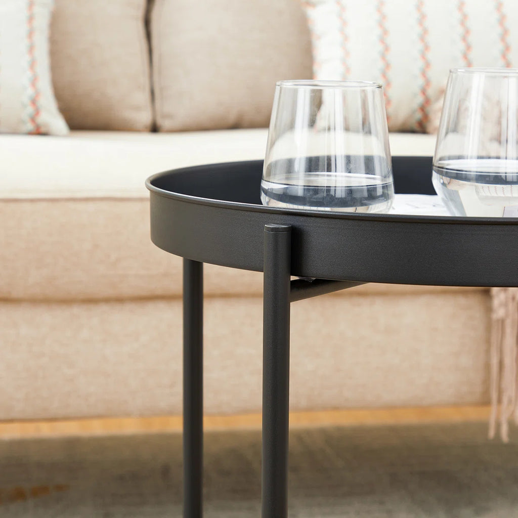 Rundt sidebord i metal med bakke-top